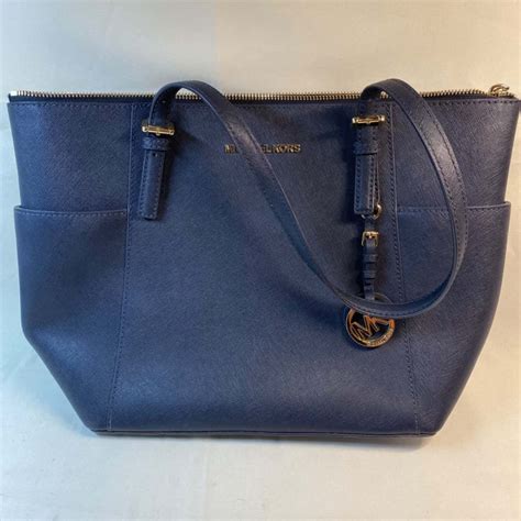 michael kors blue leather purse.